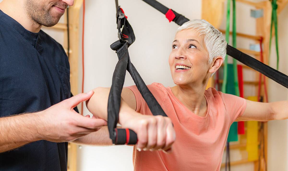 Older Woman Working with Physical Therapist