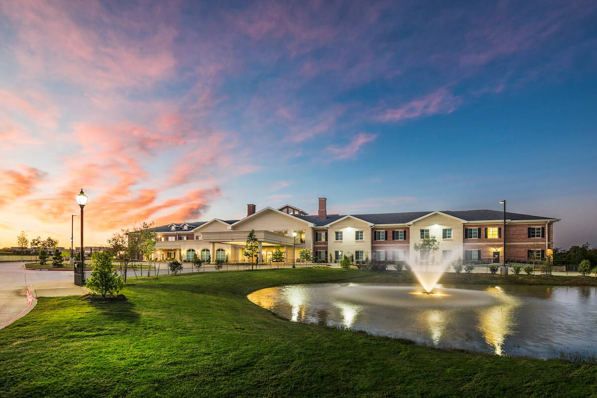 HarborChase of Southlake-Exterior Water Feature at Sunset_Senior Living in Texas