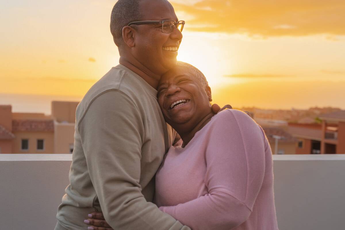 Older Couple Hugging During Sunset-Dementia Care-HarborChase Senior Living