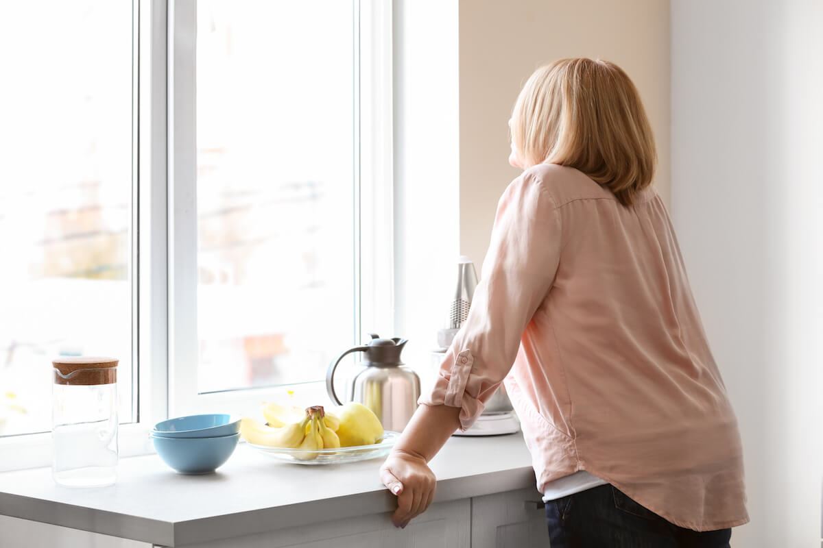 Depressed senior woman in kitchen at home-Recognizing anxiety in seniors