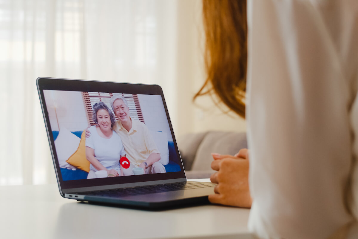 Older Couple on Computer Screen via Video Chat-Long-Distance Caregiving