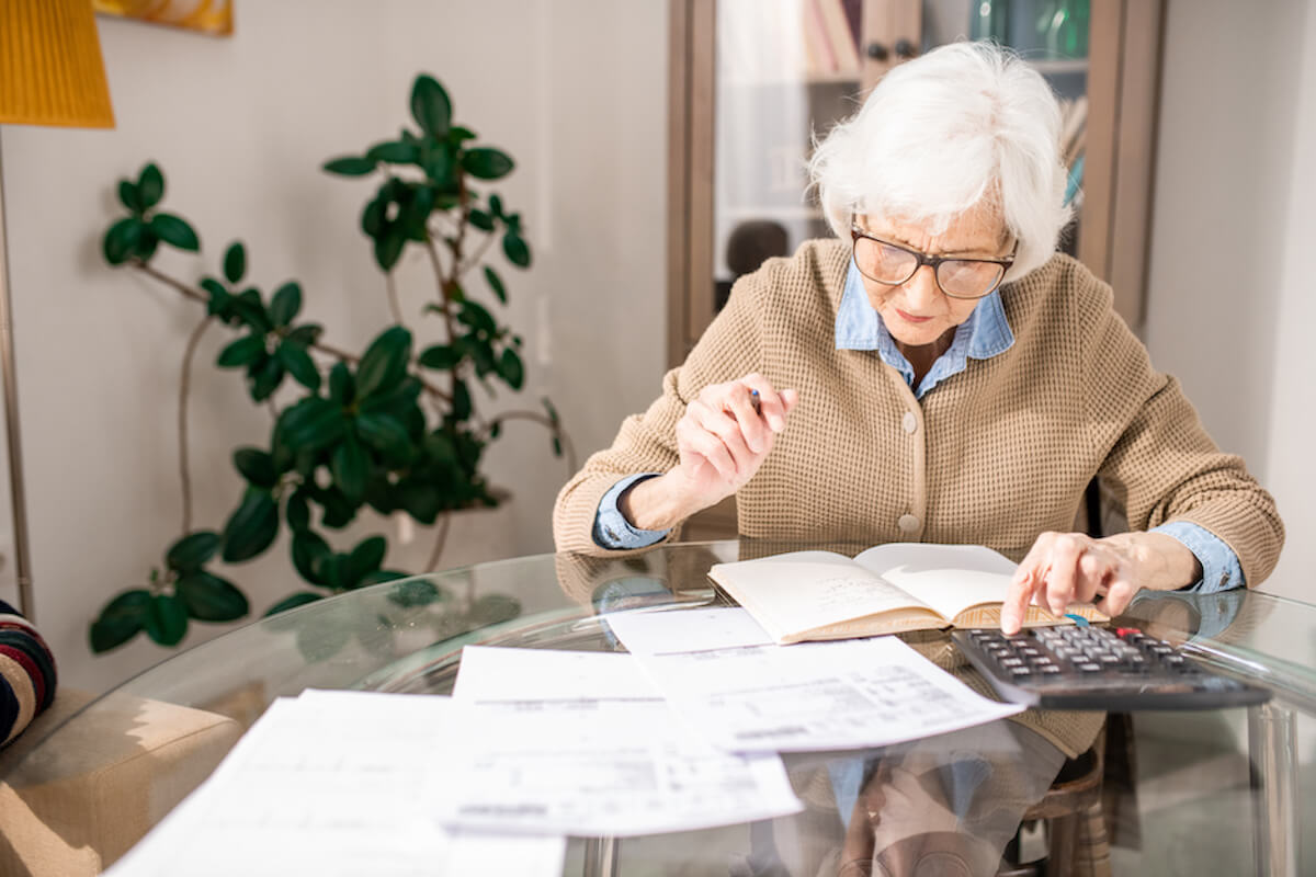 senior-woman-bookkeeping-Retirement at HarborChase Senior Living
