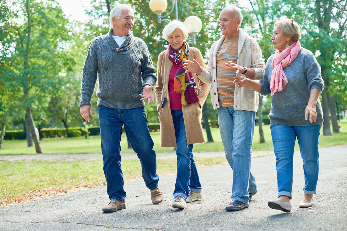 Group of Seniors Walking Outside, Smiling