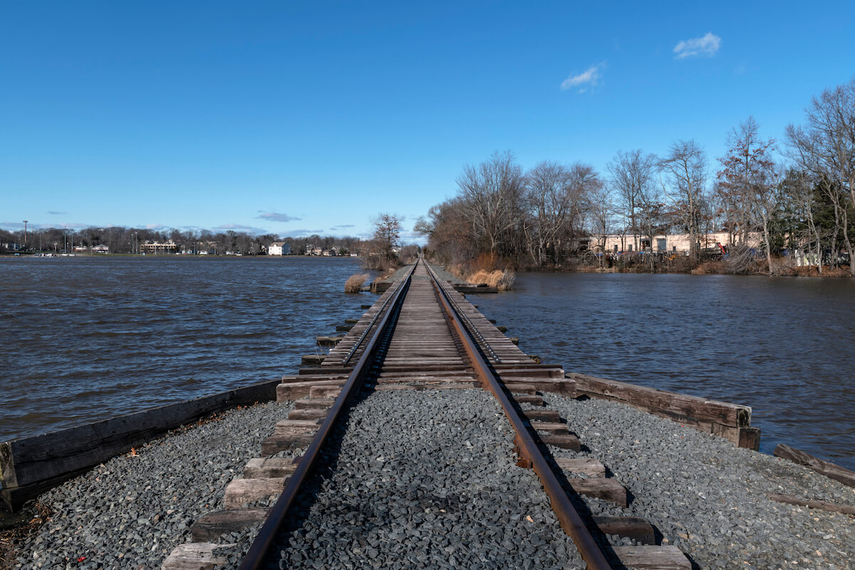 Railroad tracks cross Manalapan Lake in Thompson Park in Middlesex County New Jersey.