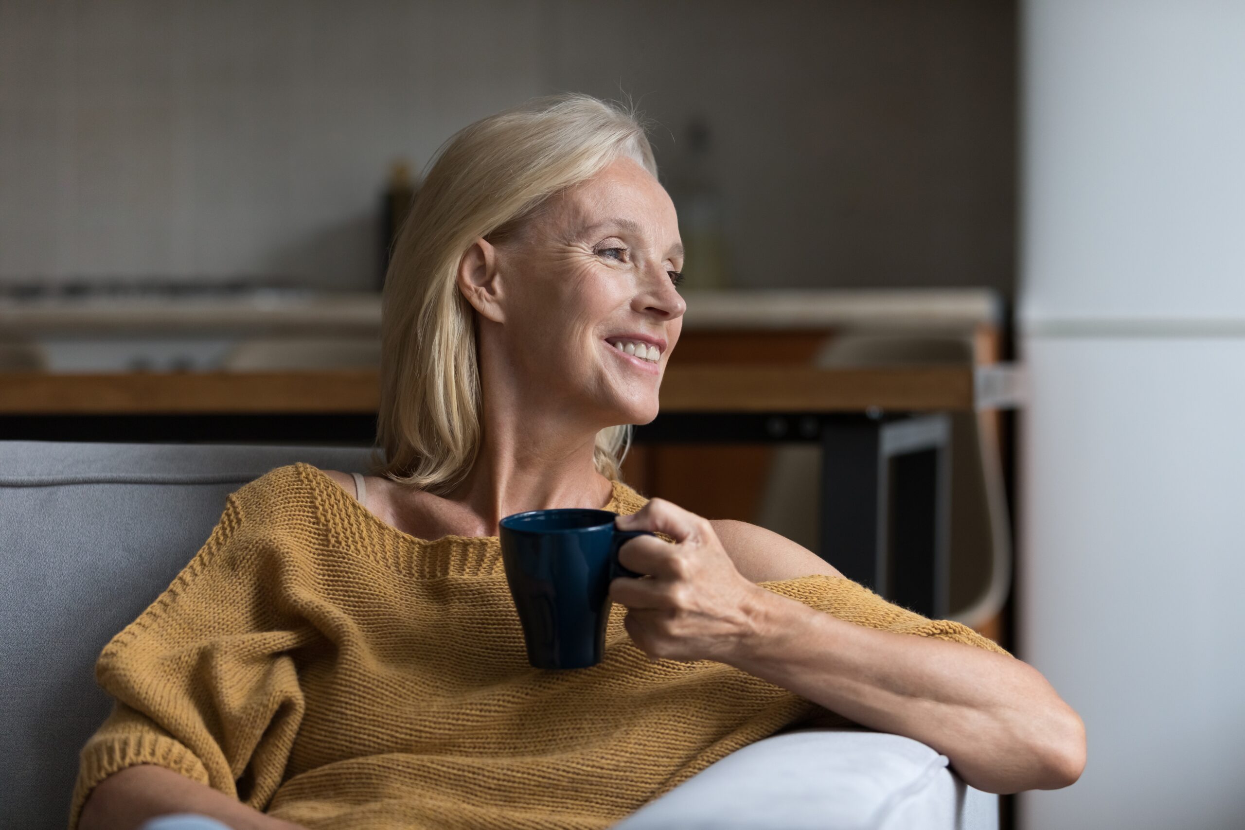 Happy Senior Blonde Lady Enjoying Morning Drinking Hot Tea