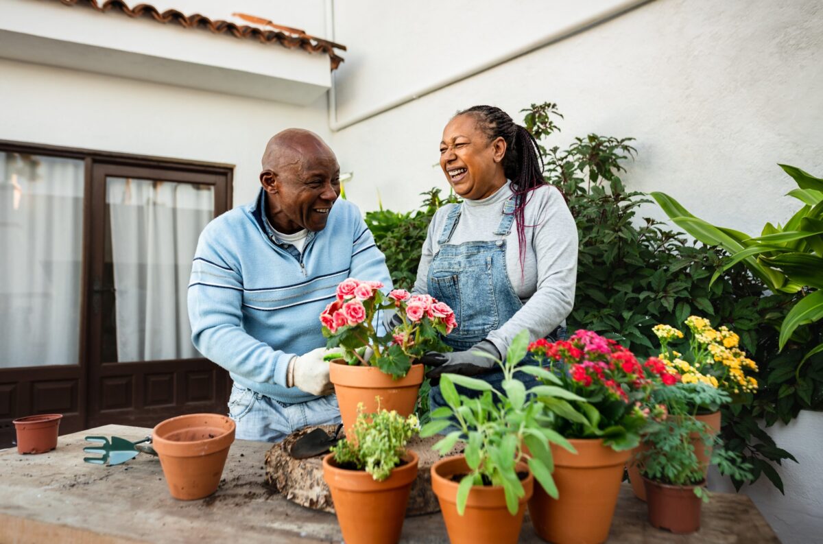 Happy senior people gardening together in ways to reinvent after retirement